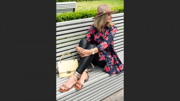 Adult woman sitting on bench photo