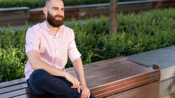 Young entrepreneur sitting on bench