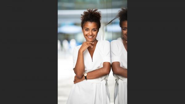 Black woman next to glass wall